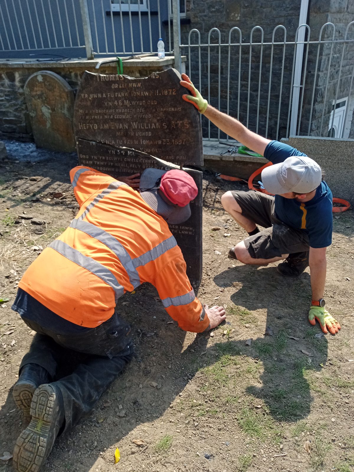 Repairing a headstone at Saron